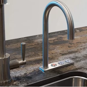 A stainless steel faucet attached to a kitchen sink needs a plumbing repair.