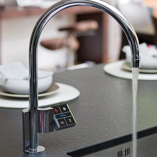 A modern kitchen with a sink and a faucet.