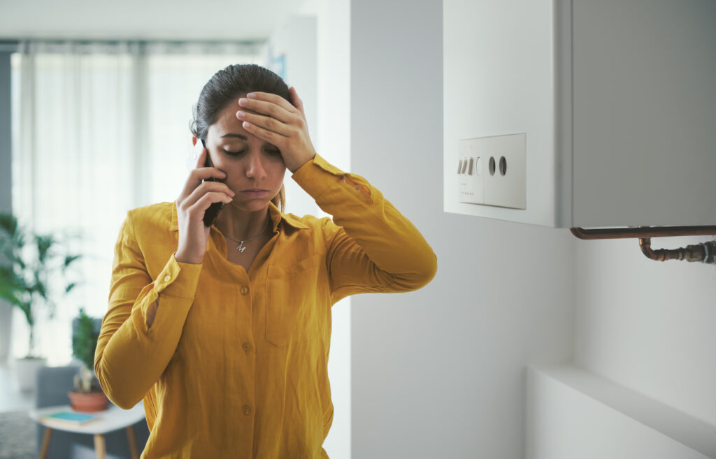 Woman calling a boiler breakdown service