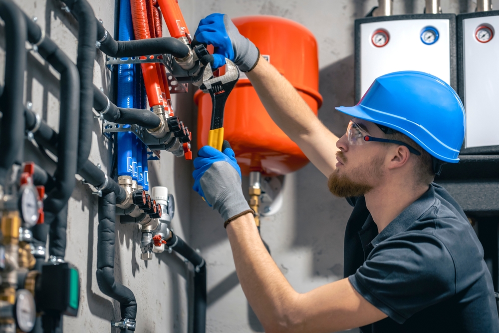 person installing water lines